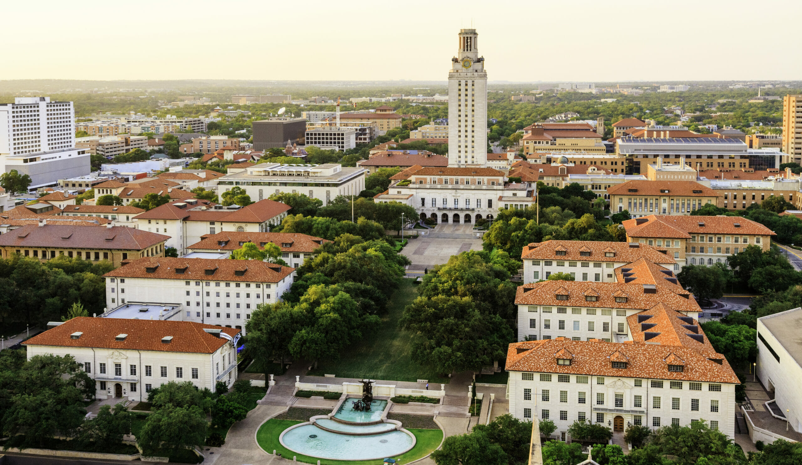 school and higher education law image, University of Texas Austin campus at sunset-dusk, aerial view